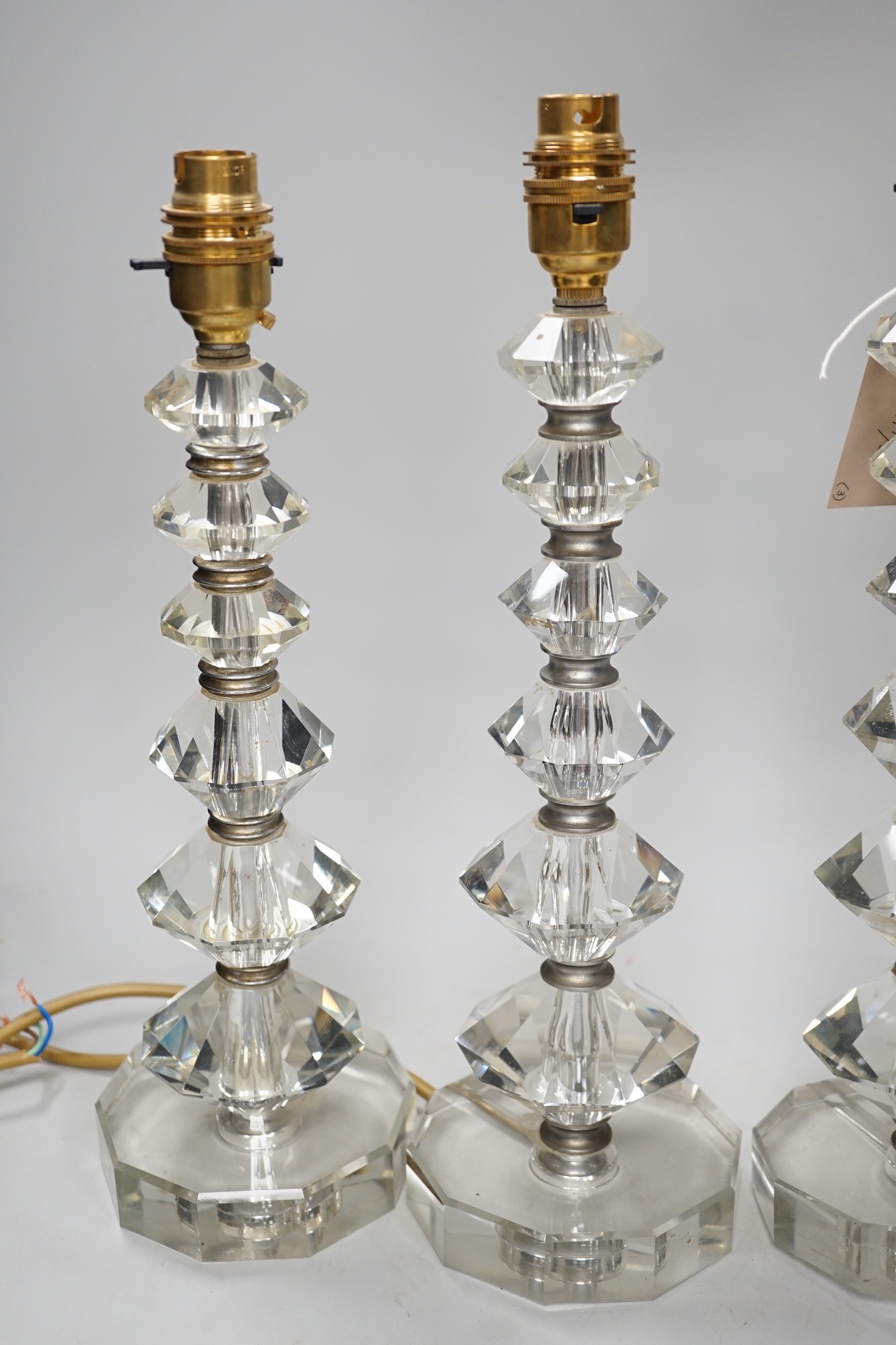 A set of three Art Deco cut glass table lamps 37cm total height